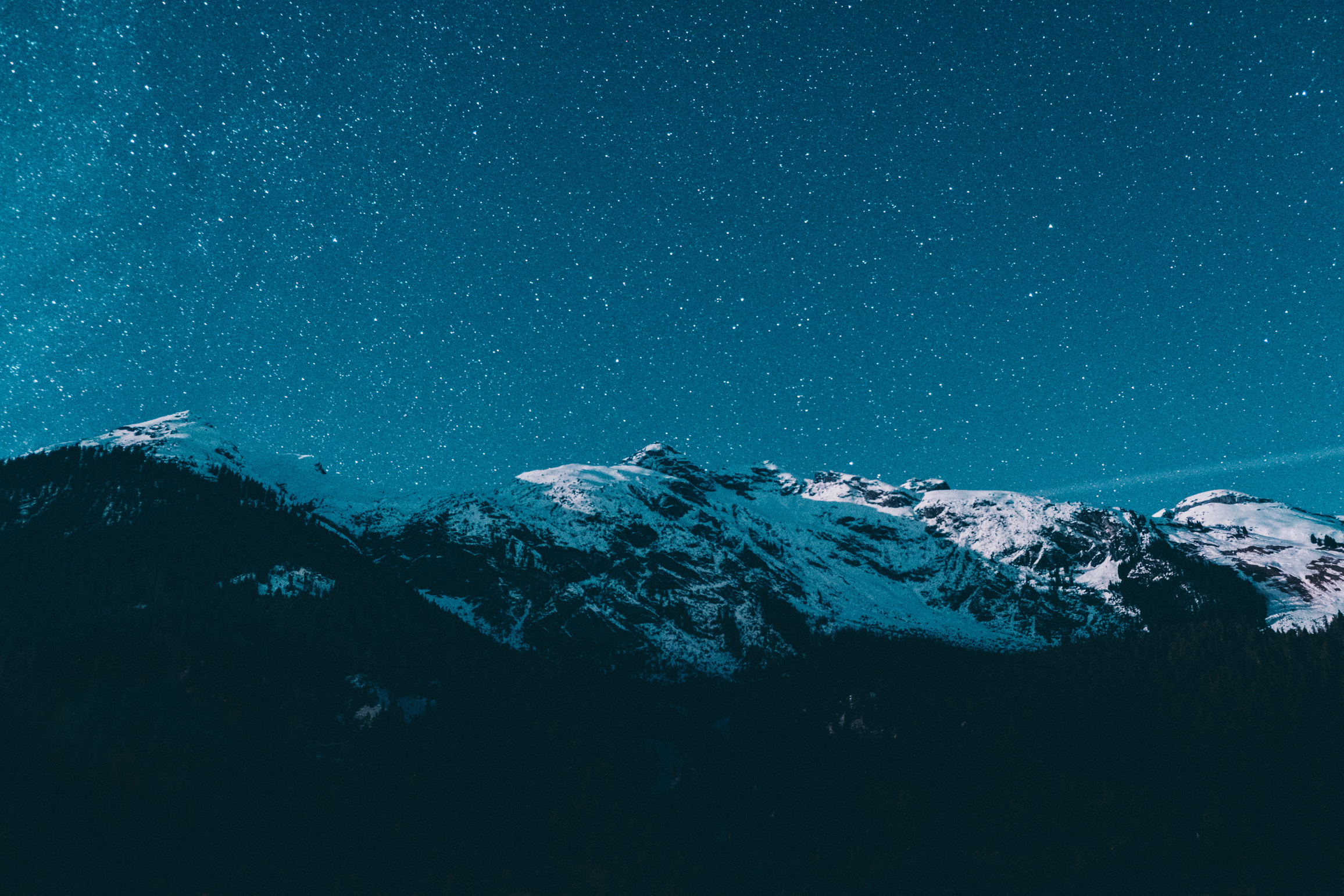 Snowy mountain view at night 